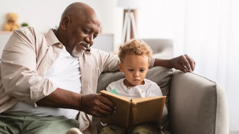 Man With His Grandson Reading